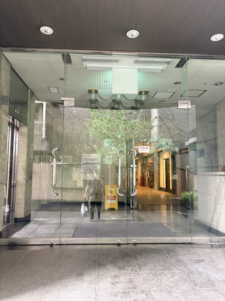 Glass entrance doors to Sun Felista Meguro